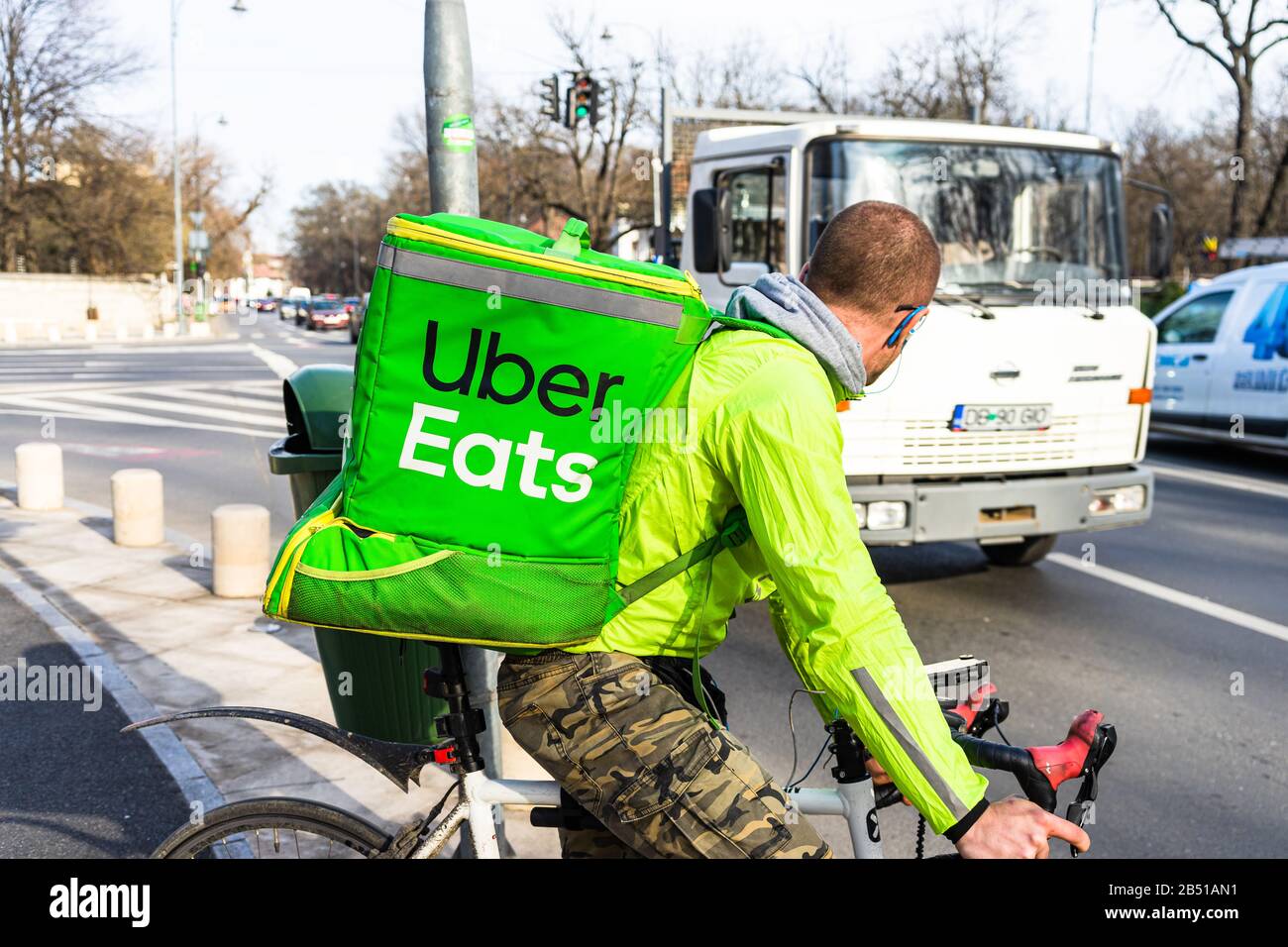 Logo of 'Uber Eats' on the green backpack of a delivery boy on a bicycle in  the centre of Prague. Uber Eats is an online food delivery service Stock  Photo - Alamy