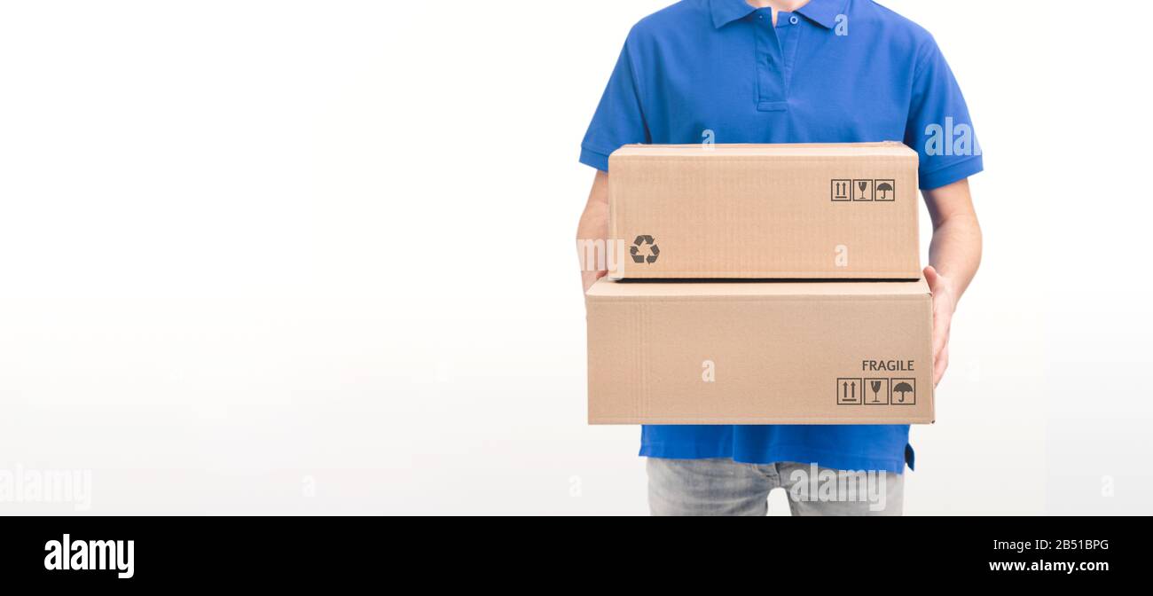 Courier delivery service. Unrecognizable person holding boxes, studio shot Stock Photo