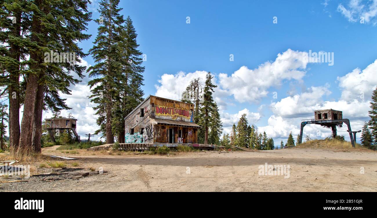 Graffiti on vandalized remains of Iron Mountain Ski Resort, store & ticket booth, chair lift, established in early 1970 as the Silver Basin Ski Area. Stock Photo