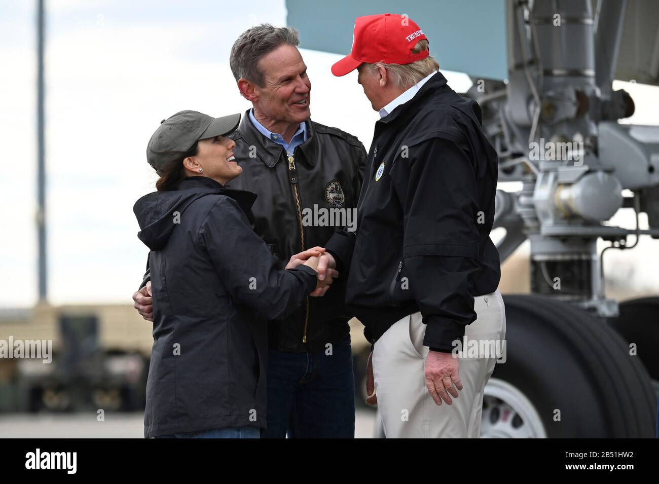 U.S President Donald Trump is greeted by Bill Lee, governor of Tennessee, and wife Maria Lee, after stepping off Air Force One at Berry Field Air National Guard Base March 6, 2020 in Nashville, Tennessee. Trump visited Nashville to survey tornado damage that killed more than 20 people. Stock Photo