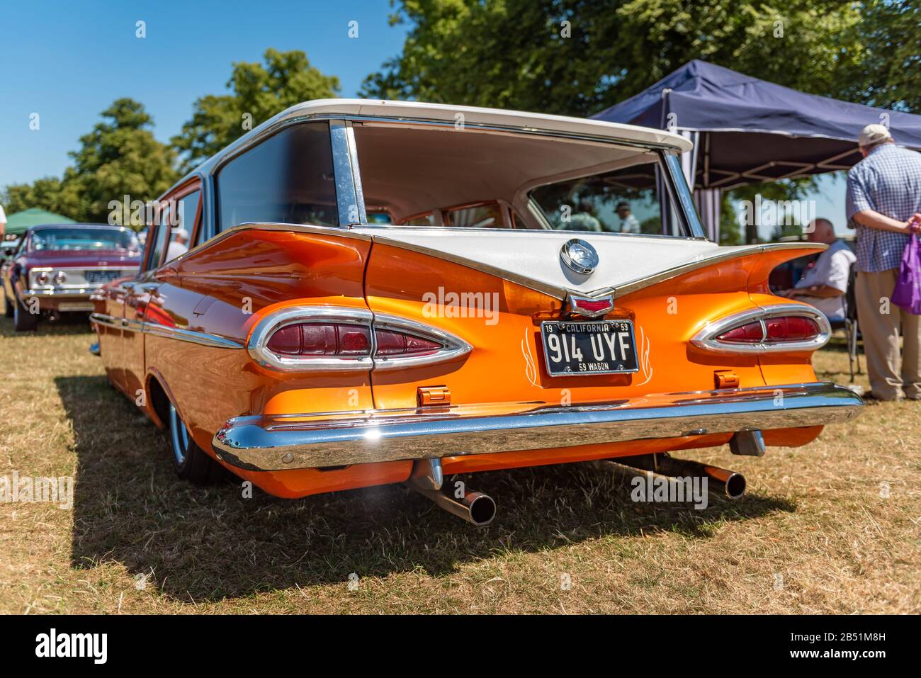 Classic American orange and white station wagon at a car show Stock Photo