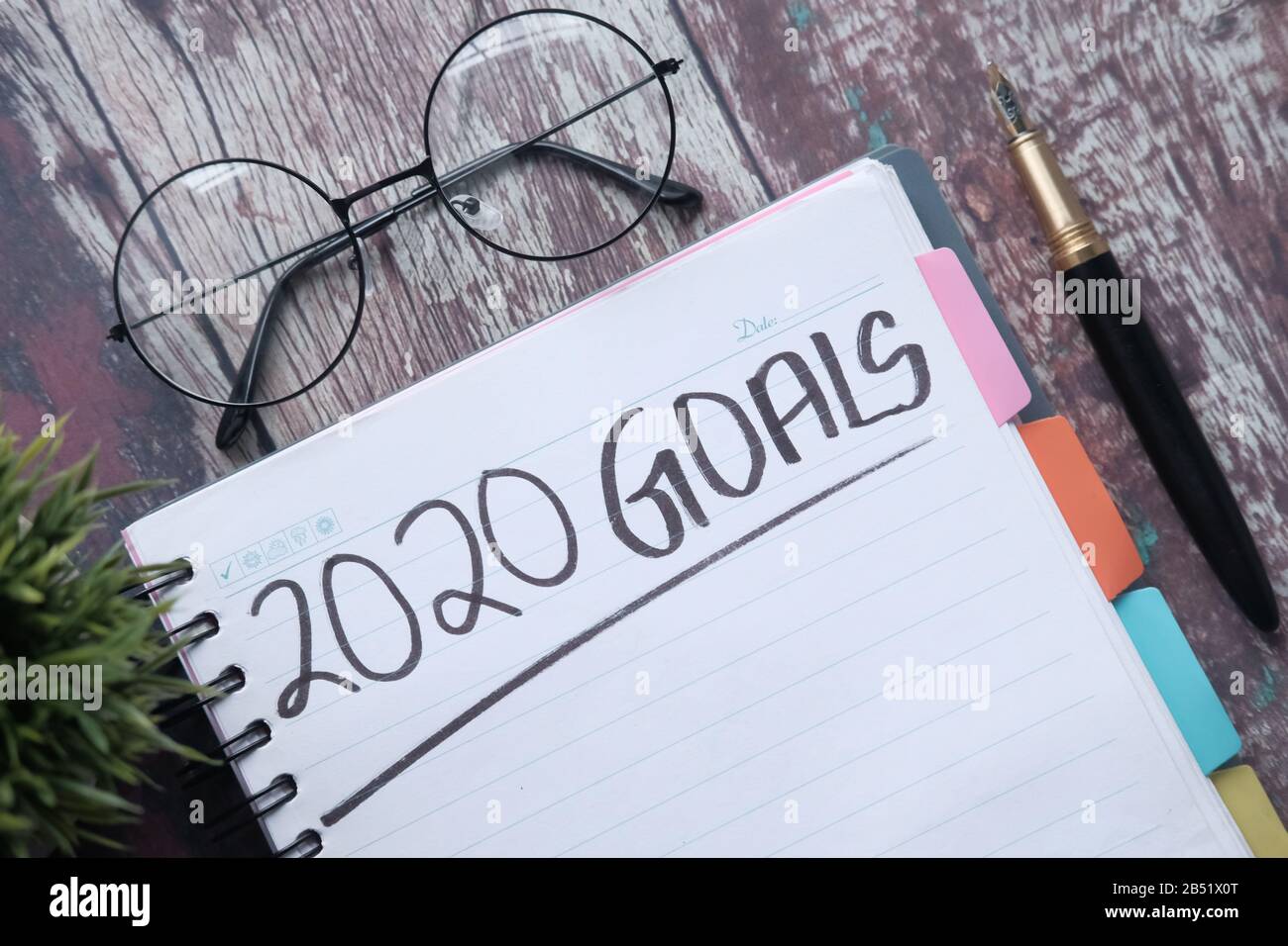 2020 new year goals on notepad on table  Stock Photo