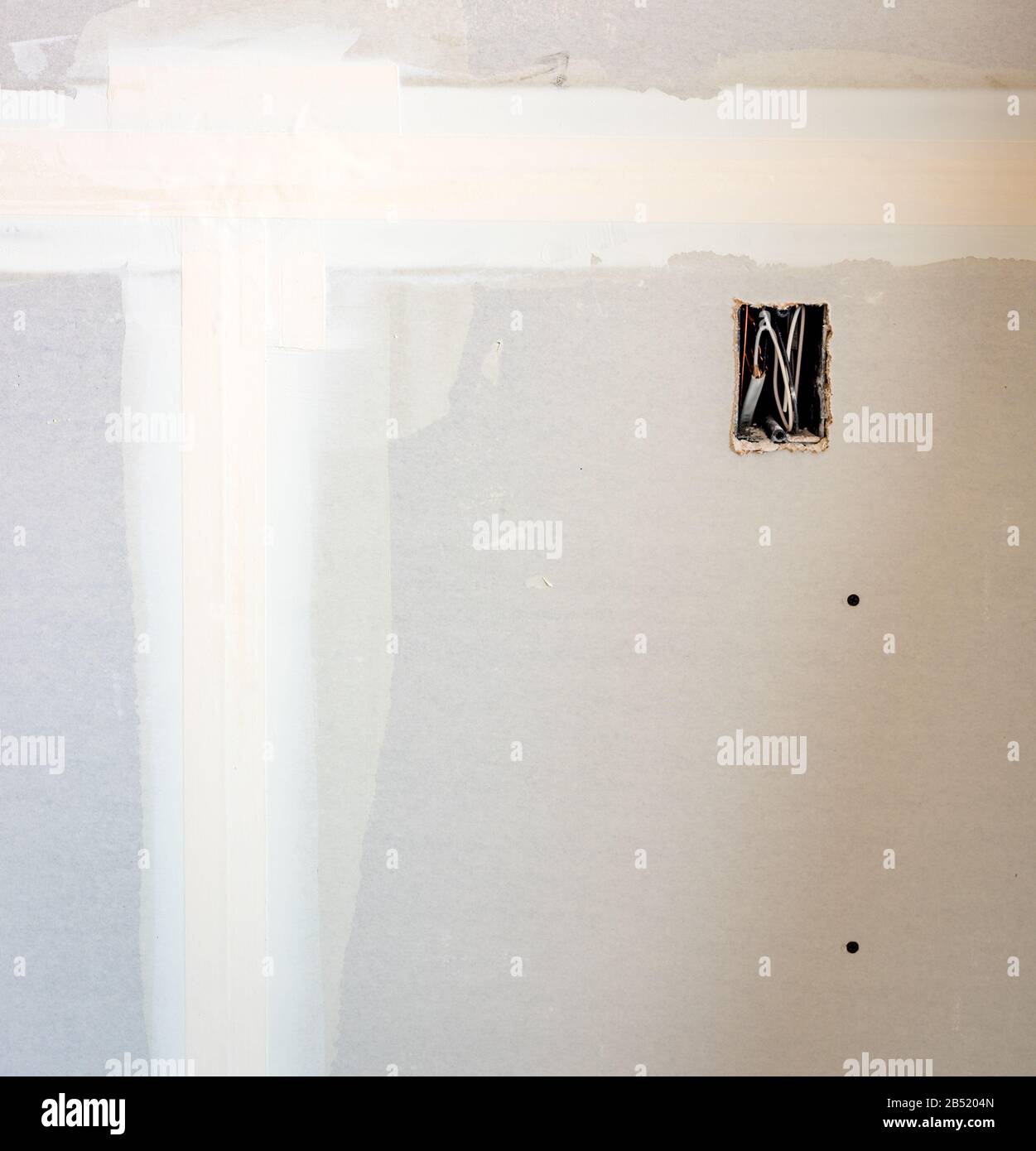 Construction site showing taped drywall and outlet box Stock Photo Alamy