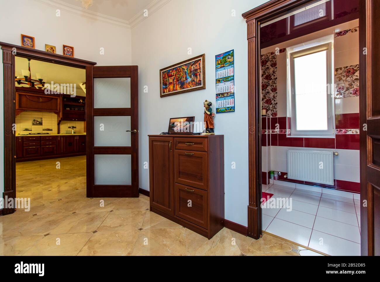 Corridor In The Cottage Open Doors Leading To The Bathroom And Hall Beautiful Wooden Doors Elite Tiles On The Floor Stock Photo Alamy