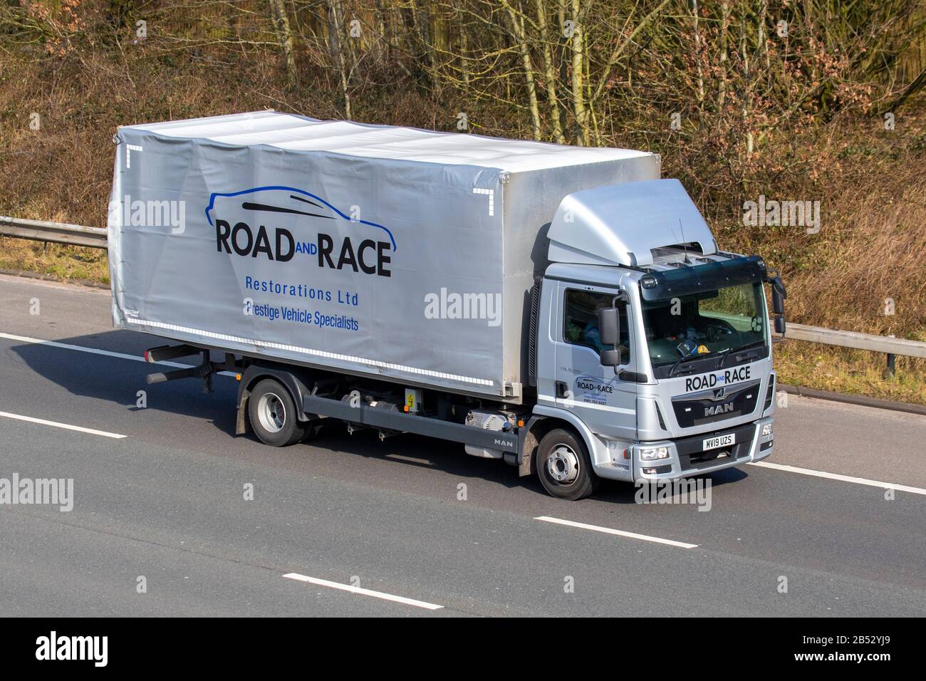 Road & Race Restorations Ltd; Haulage delivery trucks, lorry, transportation, truck, cargo carrier, MAN vehicle, European commercial transport, industry, M61 at Manchester, UK Stock Photo