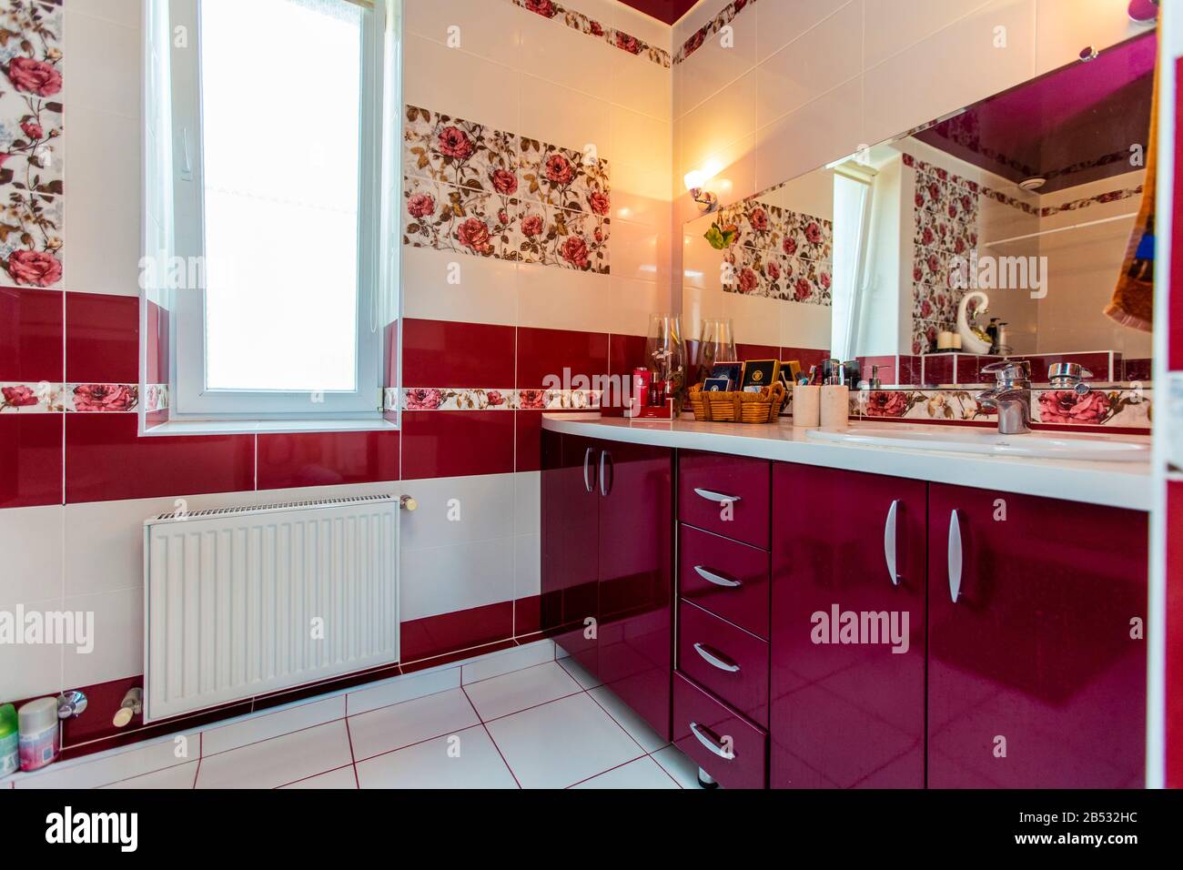 Large bathroom in the cottage in red and white colors. Maroon and white