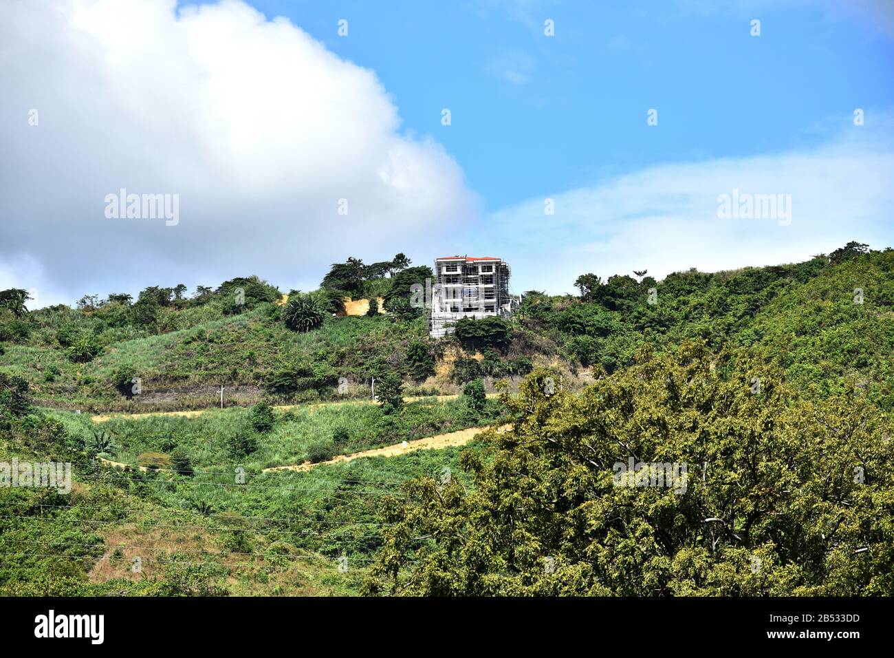 A Building On Mountain With Clouds Stock Photo