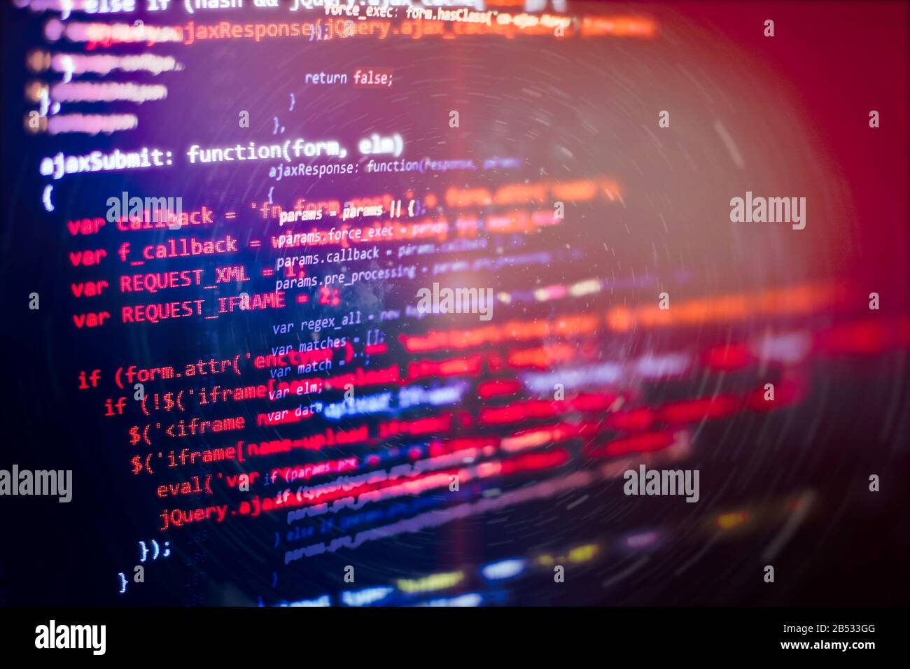 Code language on a computer screen with a shallow depth of field. Stock Photo