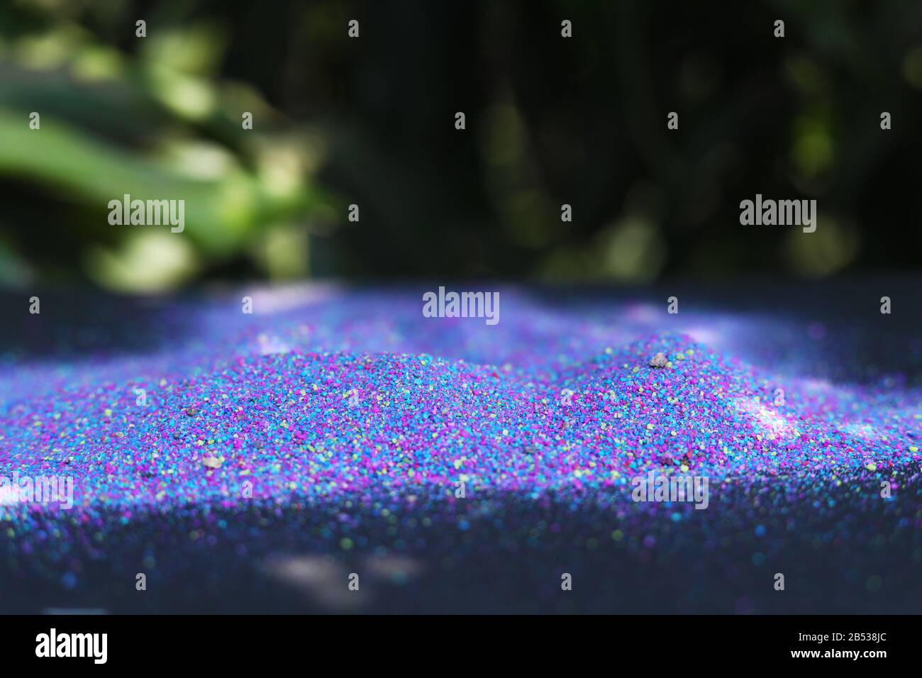 Multi-colored powder on nature background Stock Photo