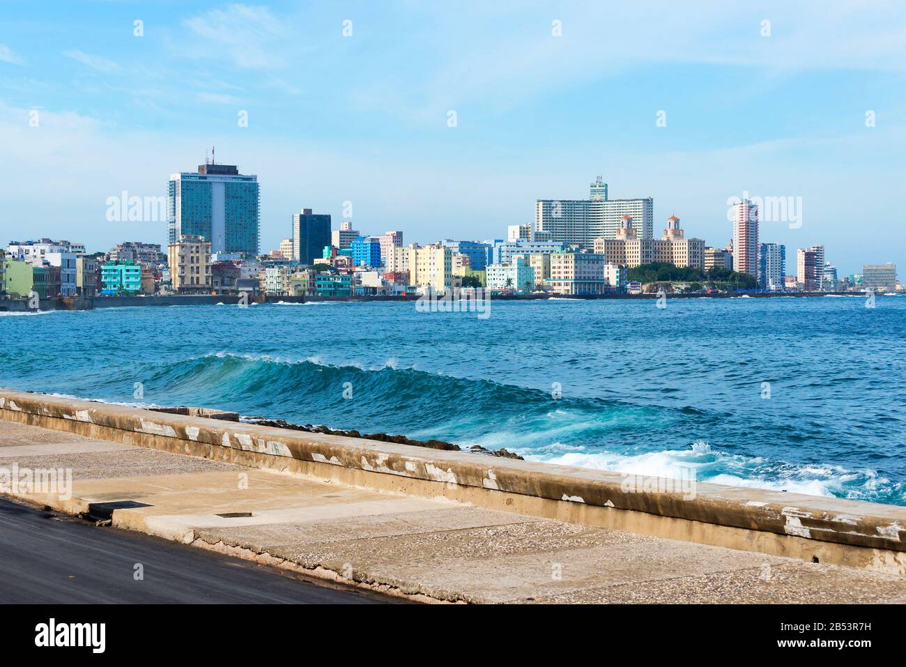 Overview of Havana skyline from Malecon, an 8km long promenade. Mix of old  and new buildings in La Habana, Cuba with the Caribbean Sea waving Stock  Photo - Alamy