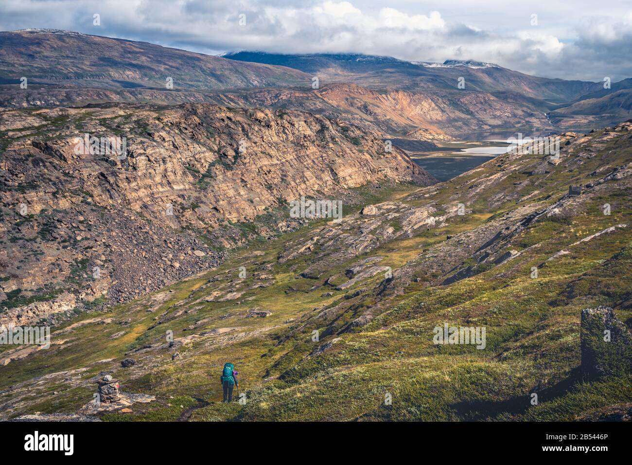 Descent to the valley with major river crossing on the Arctic Circle Trail, Greenland Stock Photo