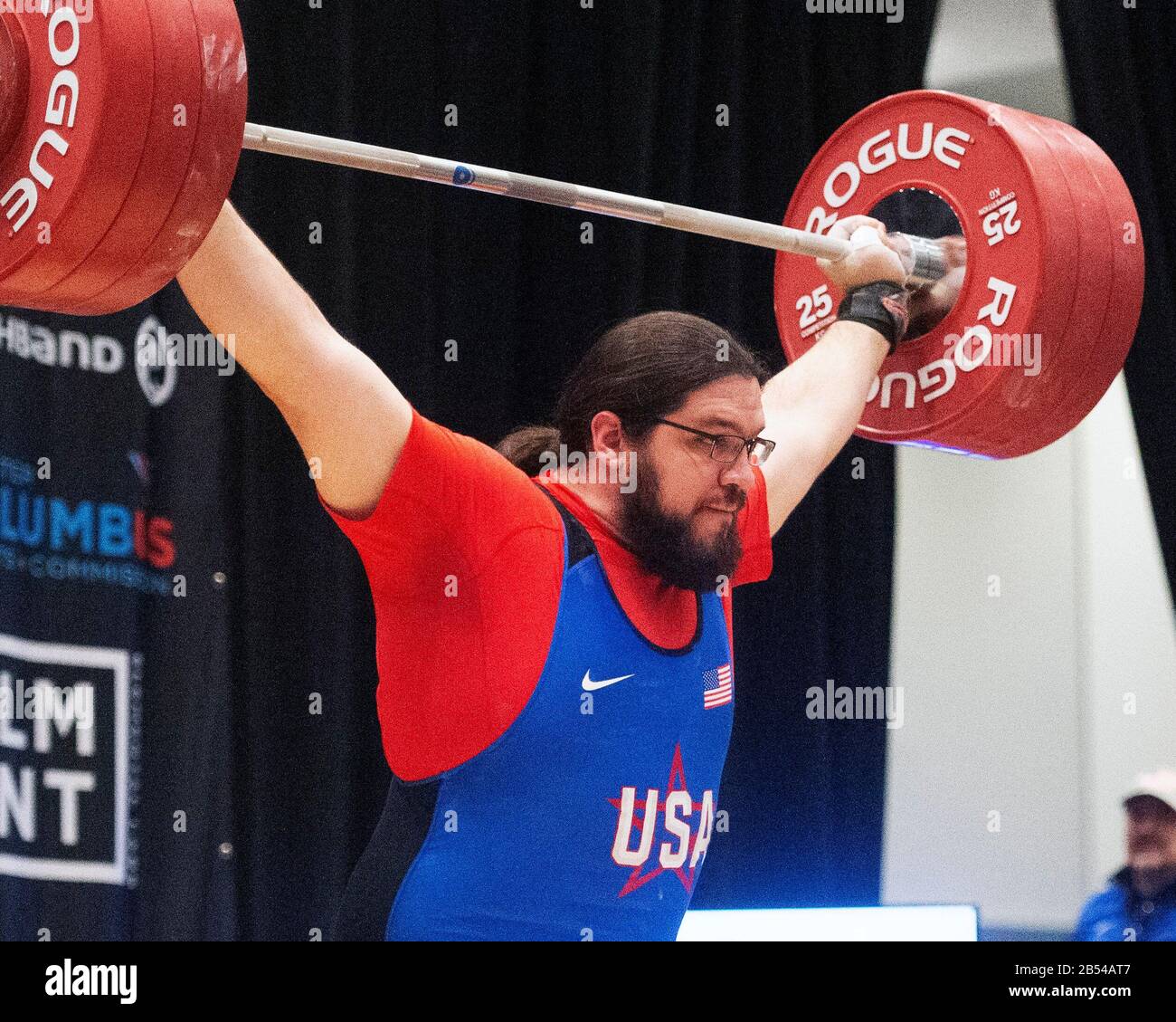 Columbus, Ohio, USA. 7th Mar, 2020. Caine Wilkes (USA) lifts 180 kgs. in the snatch in the IWF Rogue World Challenge in the Arnold Sports Festival in Columbus, Ohio, USA. Columbus, Ohio, USA. Credit: Brent Clark/Alamy Live News Stock Photo
