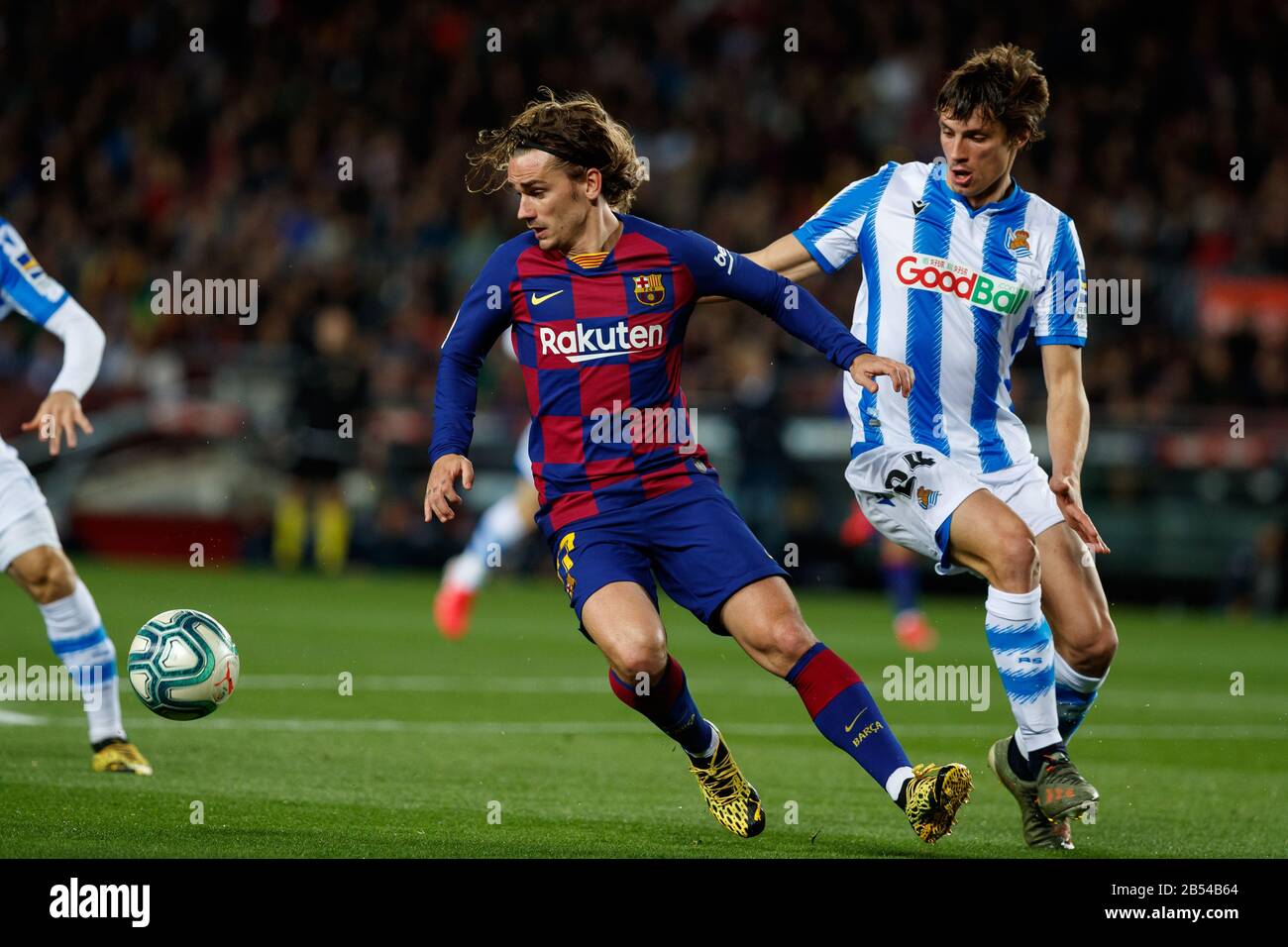 BARCELONA, SPAIN - MARCH 07: Antoine Griezmann of FC Barcelona in action with Junior Firpo of FC Barcelona during the Liga match between FC Barcelona and Real Sociedad at Camp Nou on March 07, 2020 in Barcelona, Spain. Stock Photo