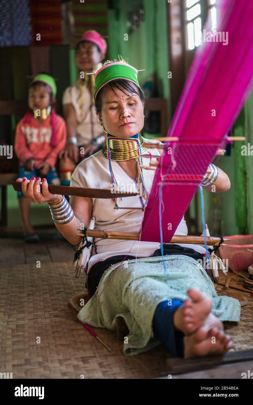 Portrait of the Long neck girl and woman in their house, Inle lake, Myanmar, Asia. Stock Photo