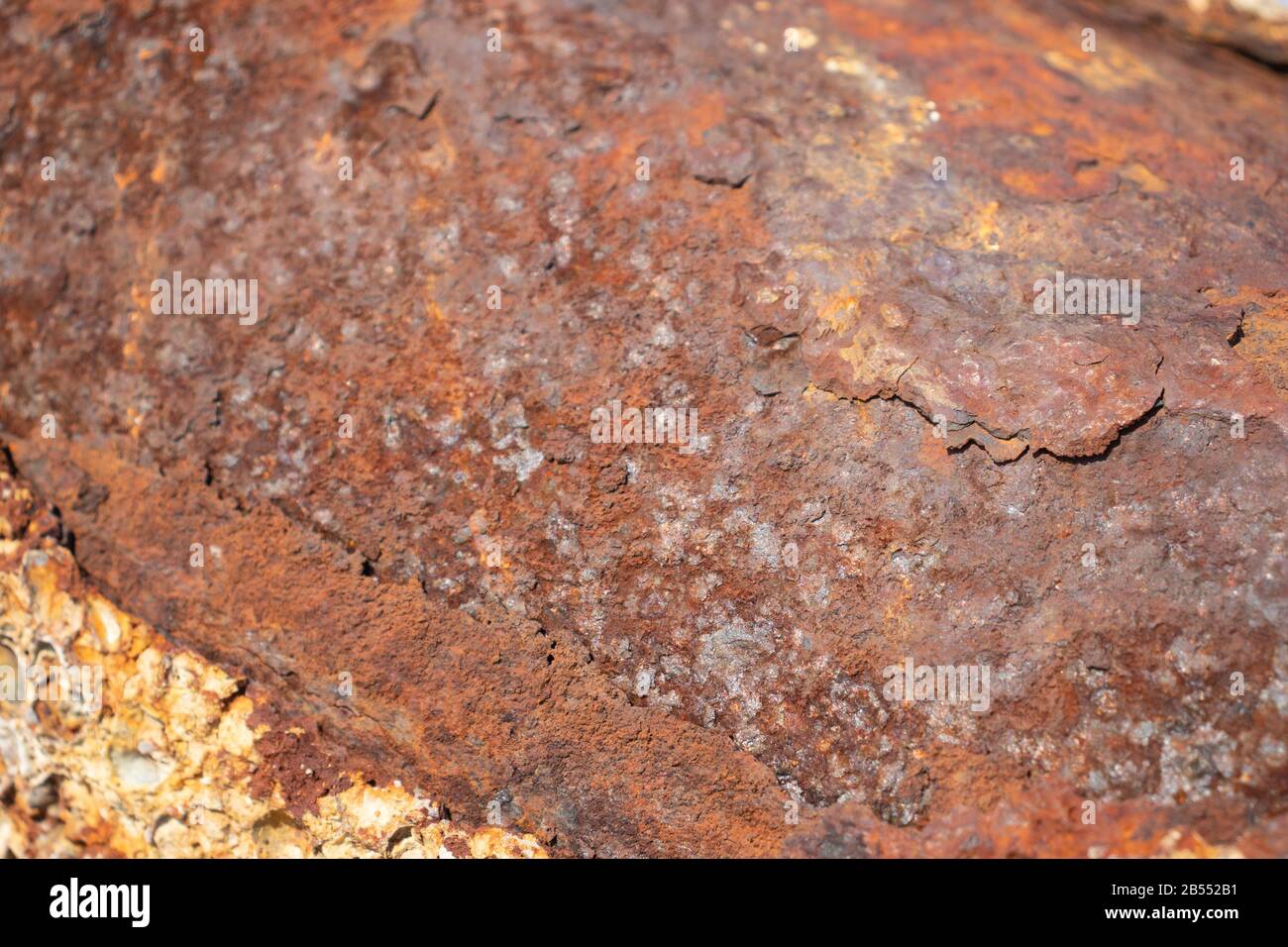 Rusty metal background with streaks of rust. The metal surface rusted spots. Stock Photo