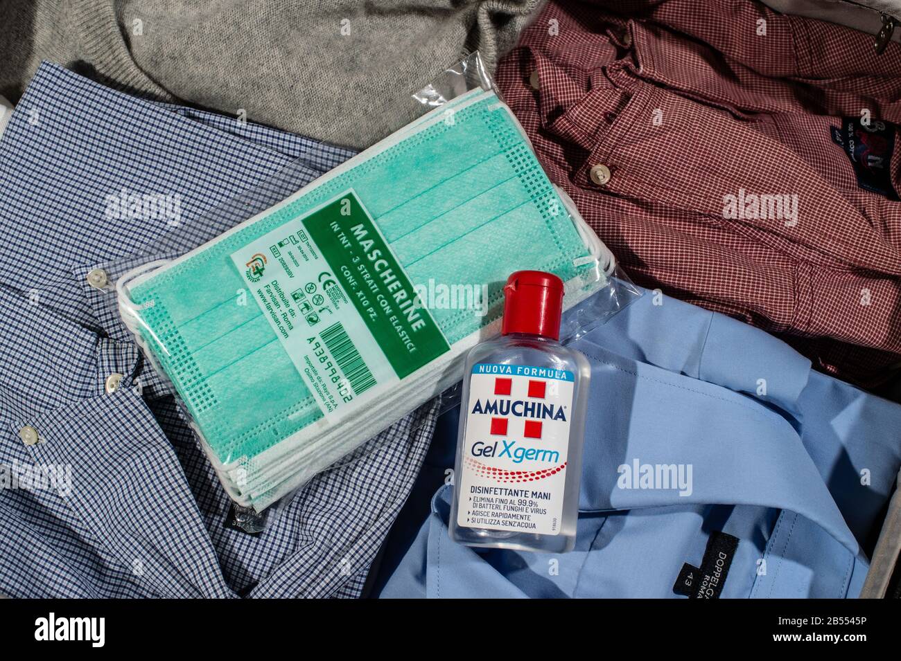 Protective masks and hand sanitizers have become indispensable for Italians who still travel, at least as much as their passport. Both are difficult to find due to the huge demand caused by the expansion of the Coronavirus epidemic in the country. Stock Photo