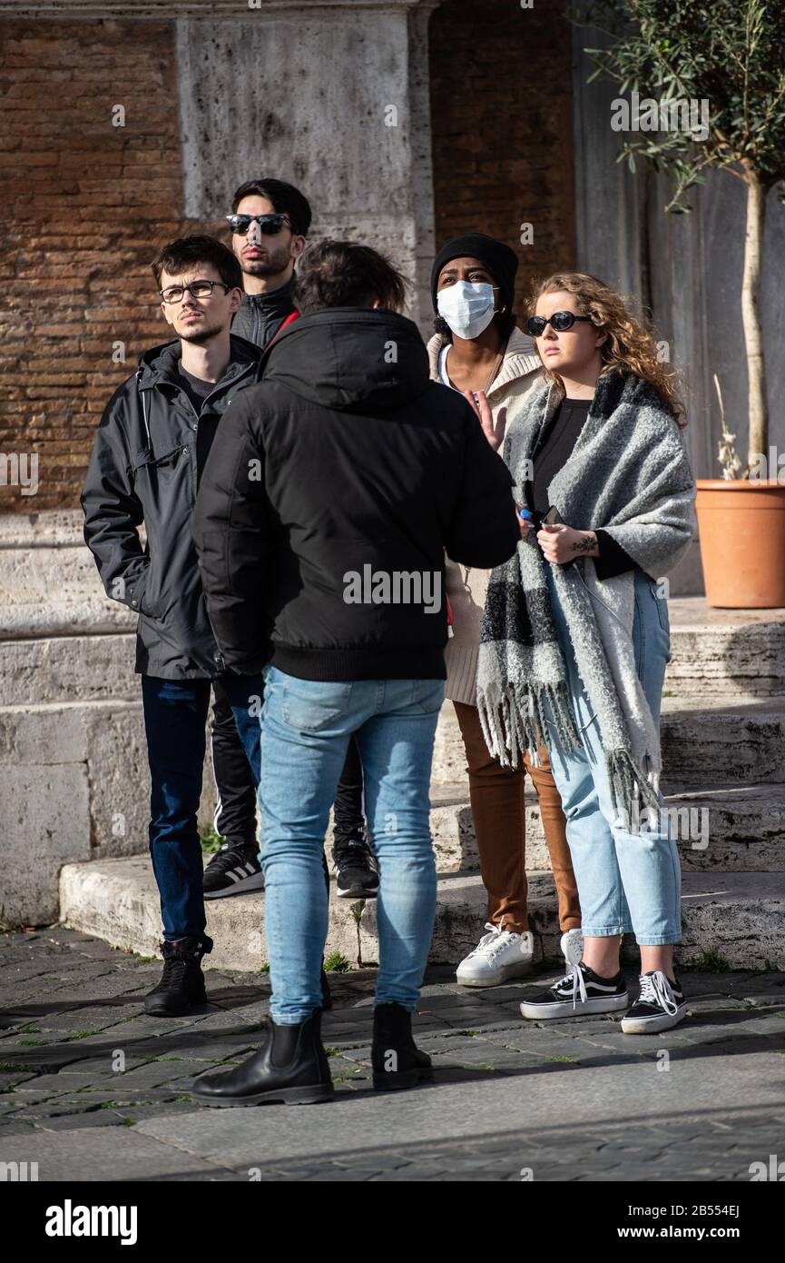 Tourists with a masks, in the center of the city of Rome, deserted by tourists for the Corona Virus epidemic that hit Italy. Stock Photo