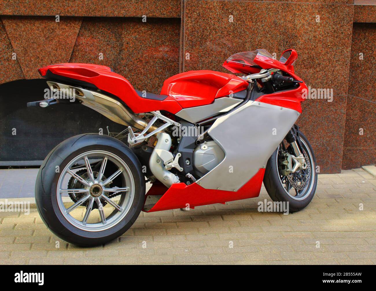 Beautiful red motocycle parked on street Stock Photo - Alamy