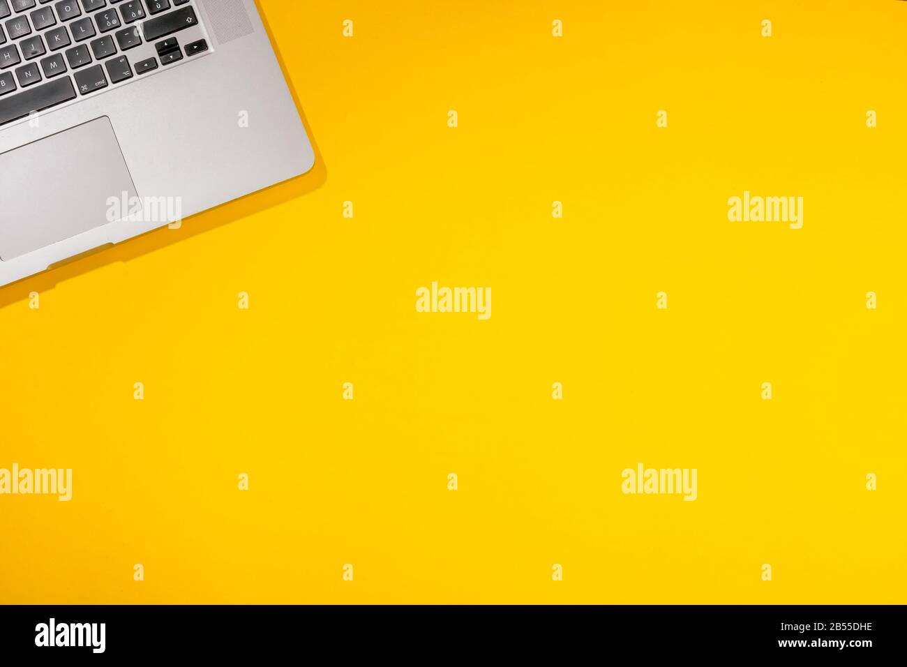 Yellow Design Layout Simple Computer Flat lay out. Computer on yellow background. Business concept idea ...