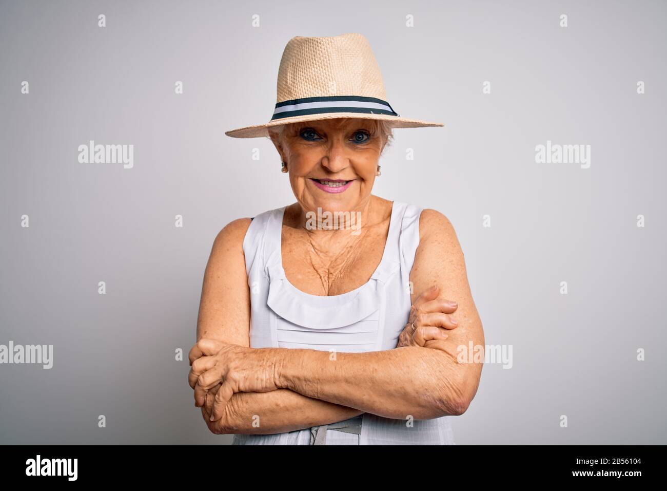 Senior beautiful grey-haired woman on vacation wearing casual summer ...