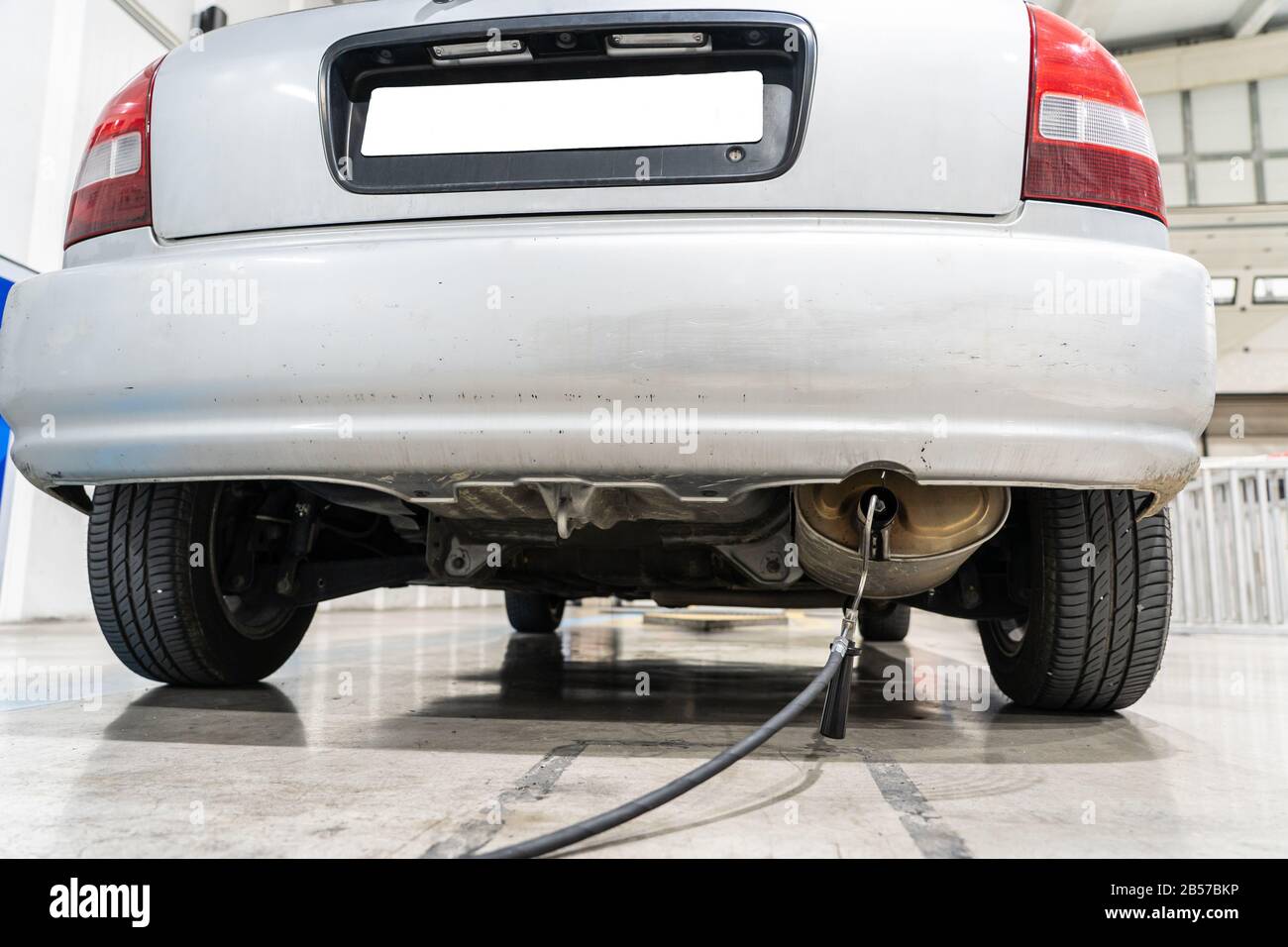 Emission control with a gas sensor in the exhaust of an old car at a