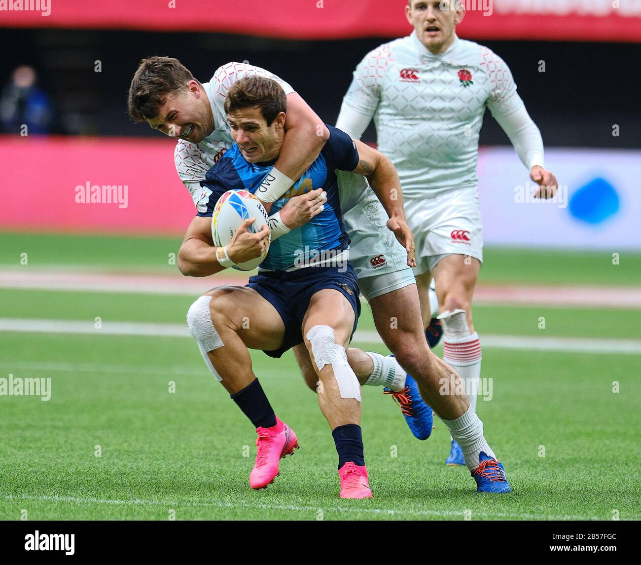 Vancouver, Canada. 7th Mar, 2020. Rodrigo Etchart #5 of Argentina tackled by England players in Match #3 during Day 1 - 2020 HSBC World Rugby Sevens Series at BC Place in Vancouver, Canada. Credit: Joe Ng/Alamy Live News Stock Photo