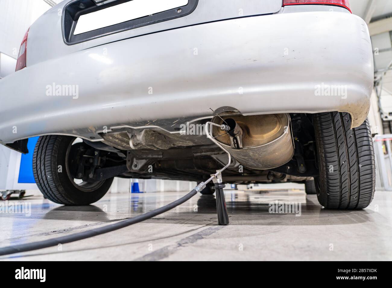 Emission control with a gas sensor in the exhaust of an old car at a