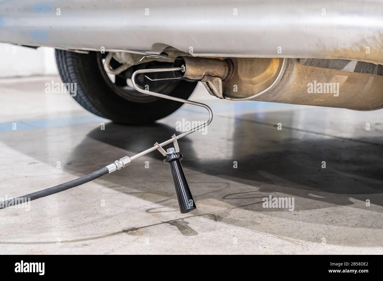 Emission control with a gas sensor in the exhaust of an old car at a