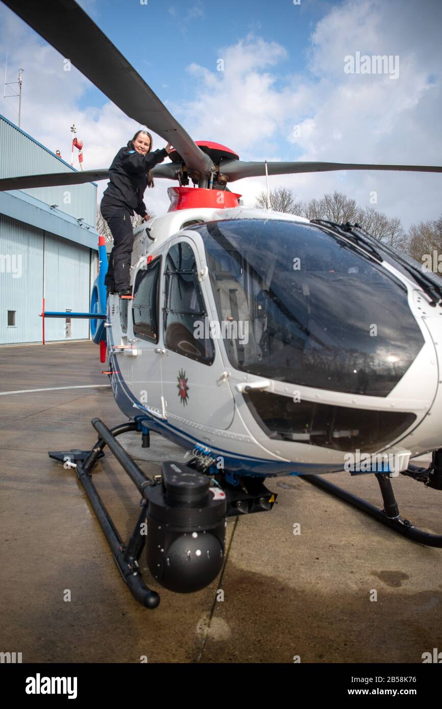 Rastede, Germany. 04th Mar, 2020. Kirsten Böning, helicopter pilot, looks at the rotor blades of the police helicopter model EC 135. Böning is the first police helicopter pilot in Lower Saxony, after a good year in service she takes stock. Credit: Sina Schuldt/dpa/Alamy Live News Stock Photo