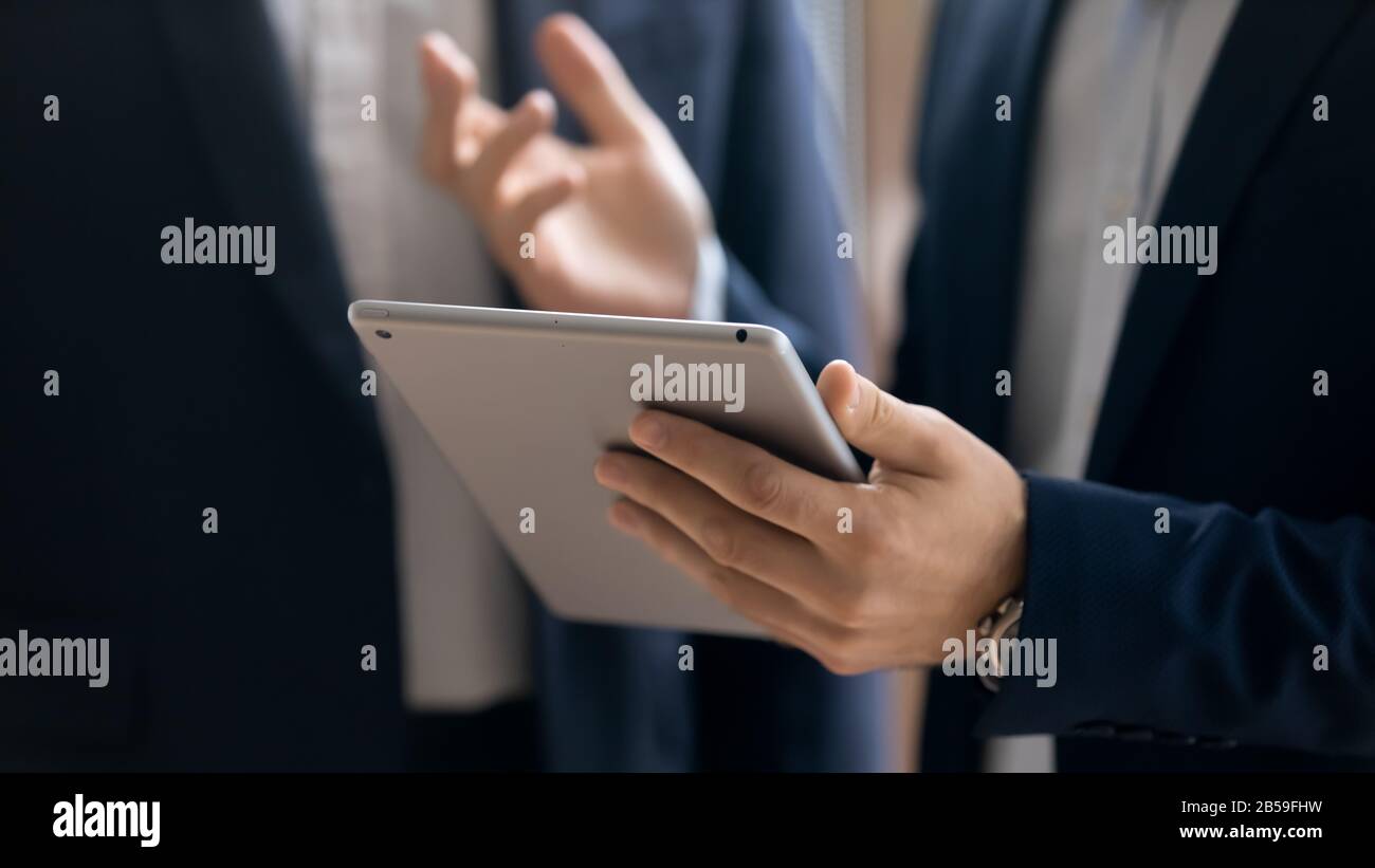 Confident businessman use modern tablet with wireless internet Stock Photo