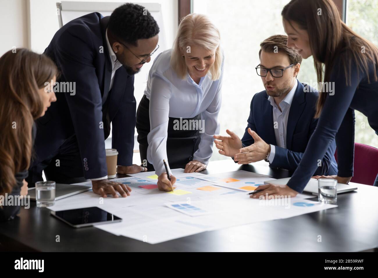 Motivated diverse businesspeople brainstorm at office briefing Stock Photo