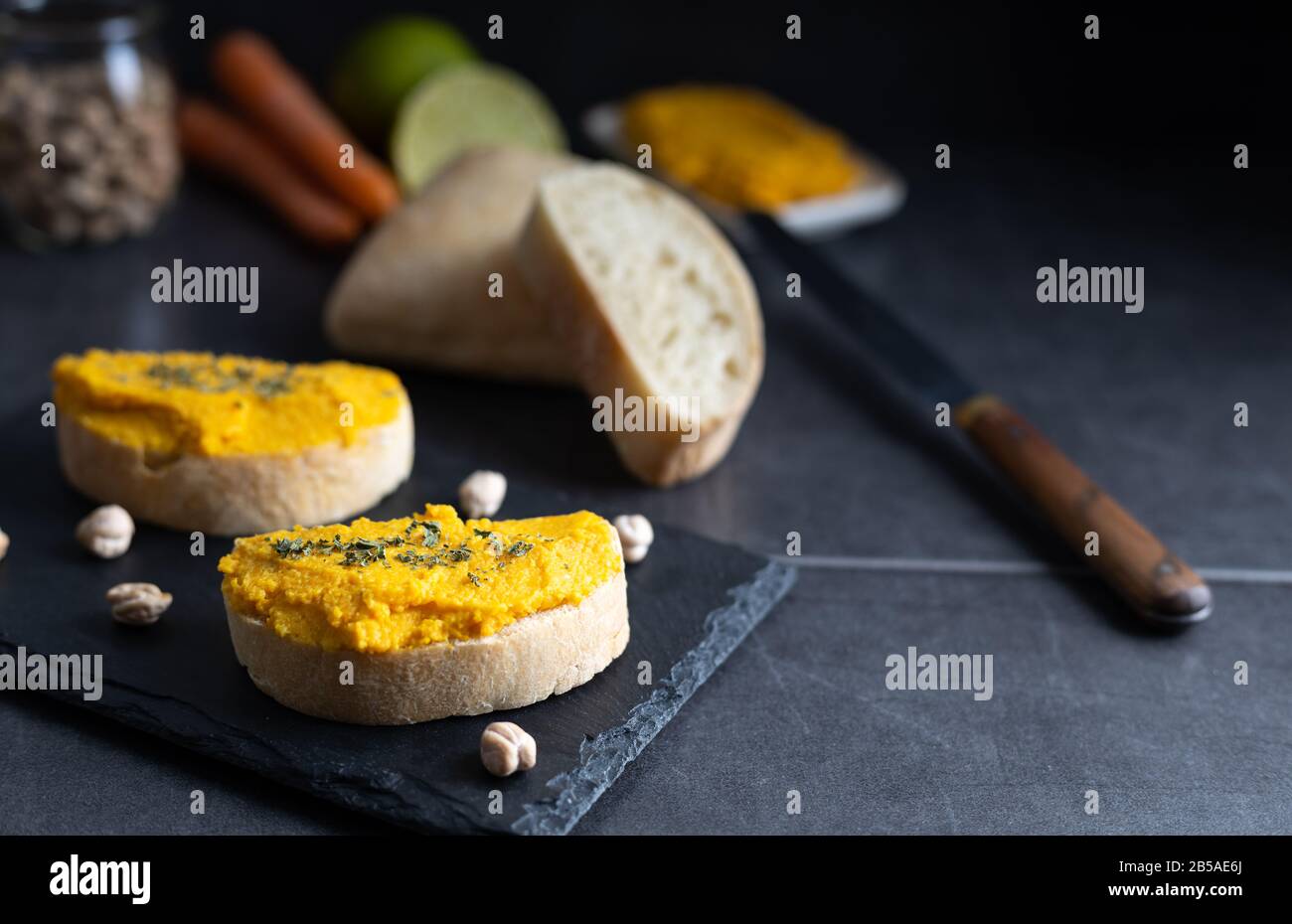 Homemade hummus chickpea spread made of chickpea, carrots, lemon and