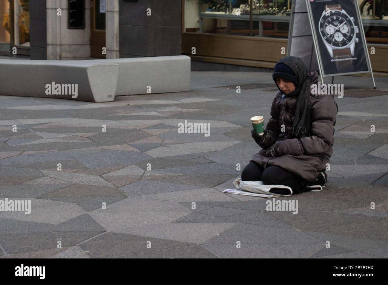 Helsinki, Finland - 3 March 2020: Poor person on street, Illustrative Editorial Stock Photo