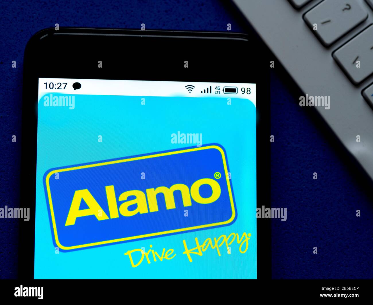 In this photo illustration the Alamo Rent a Car logo is seen displayed