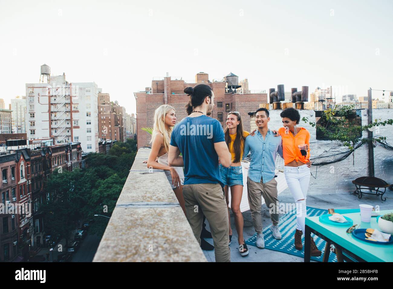 Group of friends spending time together on a rooftop in New york city