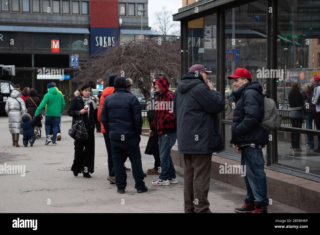 Helsinki, Finland - 3 March 2020: People standing and smoking, Illustrative Editorial Stock Photo