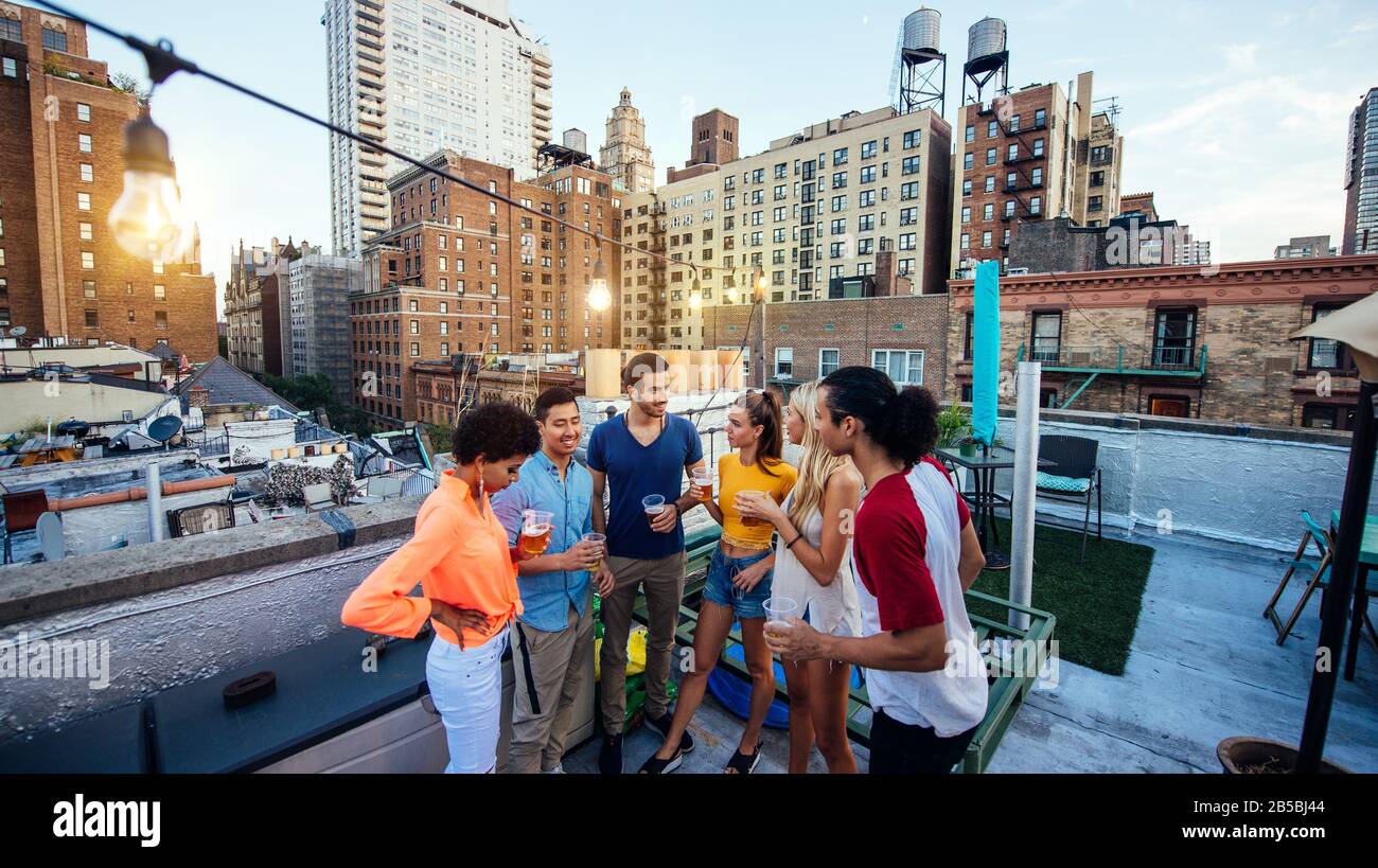 Group of friends spending time together on a rooftop in New york city