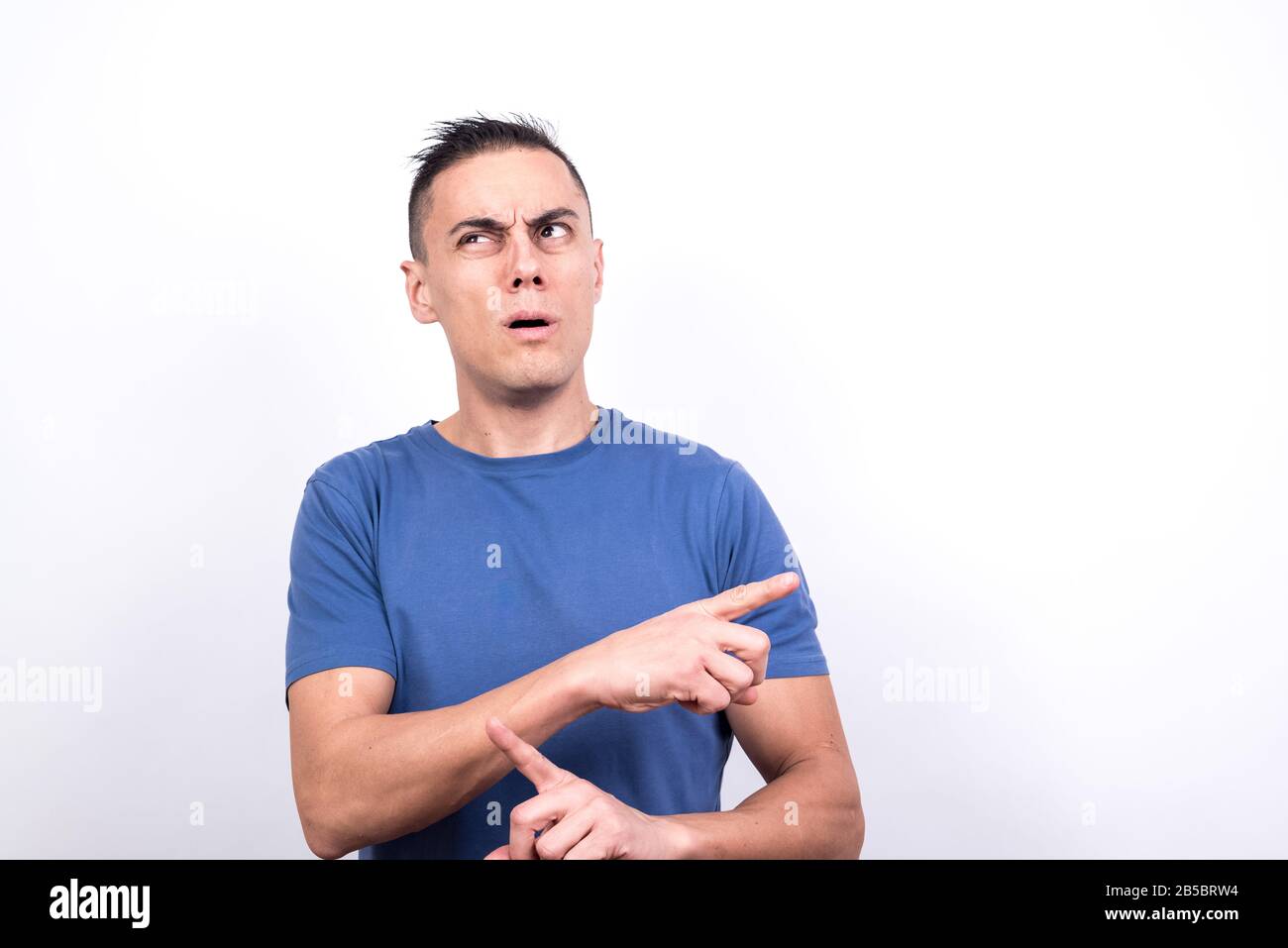 Man copy. Stock photo confused man. Парень в полосатой майке держит в руках лист бумаги. Printing man. Человек прямоугольник.