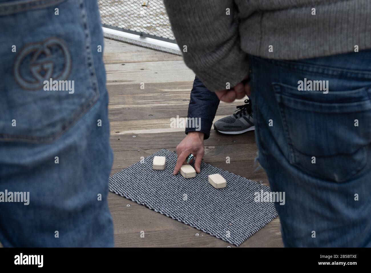 Helsinki, Finland - 3 March 2020: Street games or scammers, money gambling, Illustrative Editorial Stock Photo