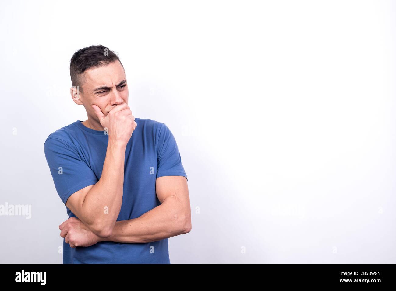 Worried man. White background, Medium shot Stock Photo