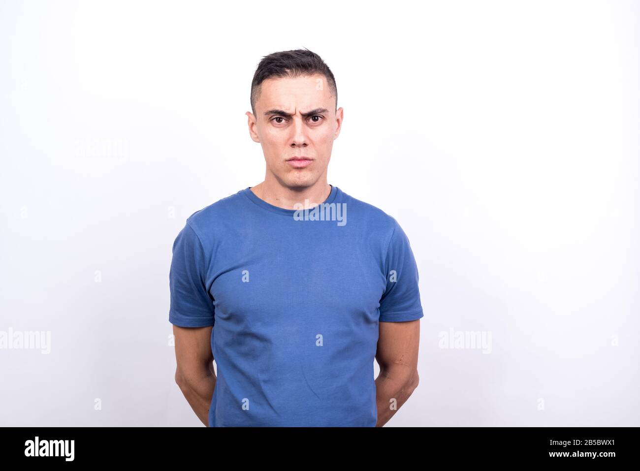 Serious man. White background, Medium shot Stock Photo