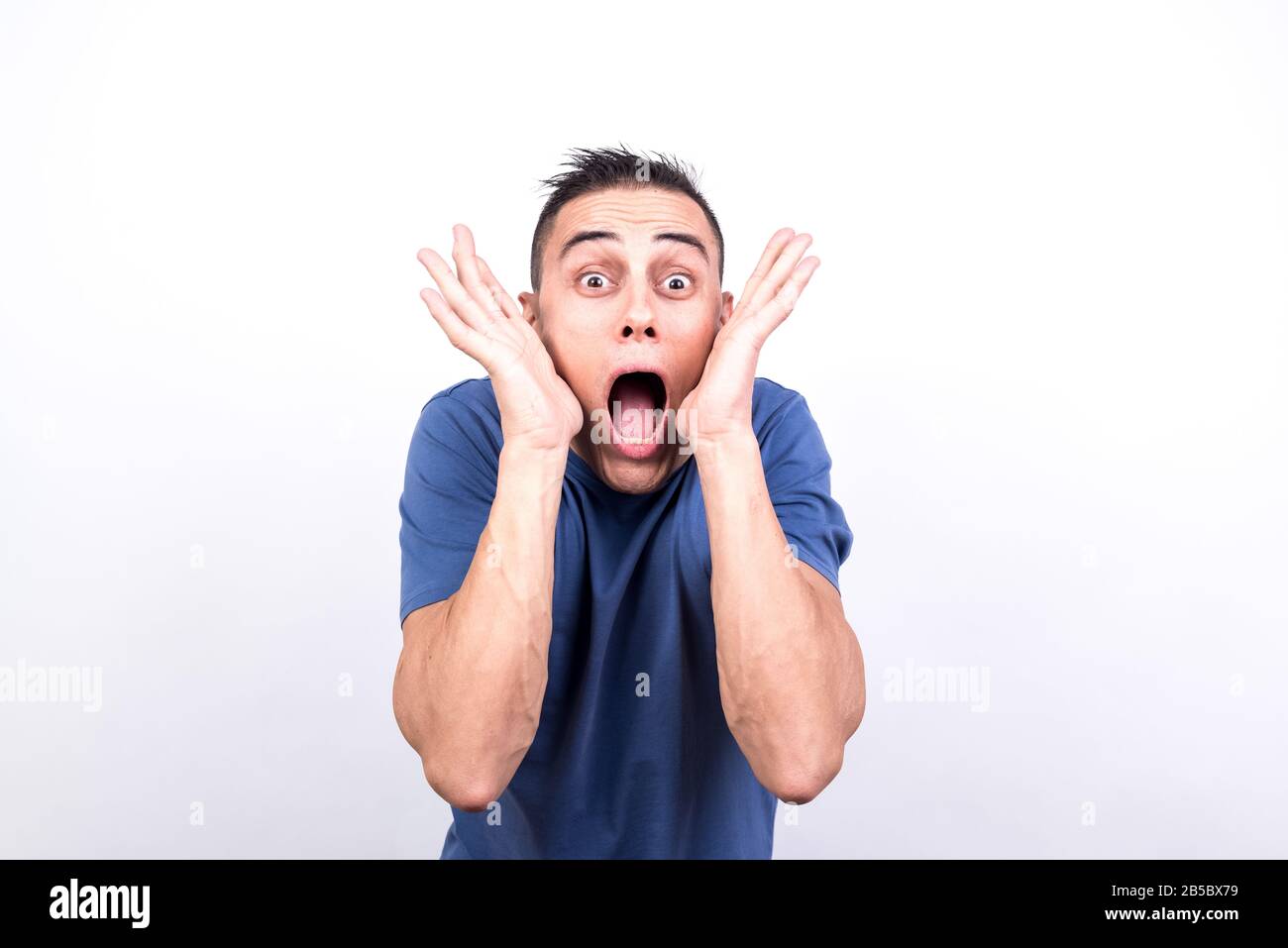Surprised man. White background, Medium shot Stock Photo