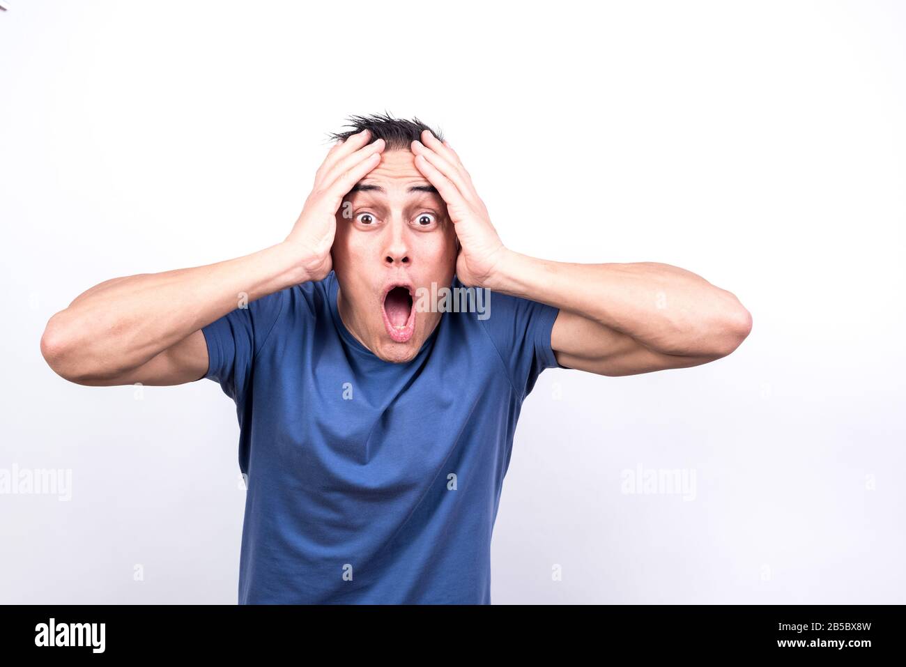 Surprised man. White background, Medium shot Stock Photo