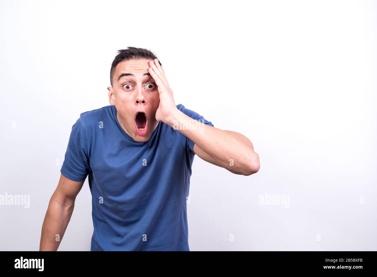 Surprised man. White background, Medium shot Stock Photo