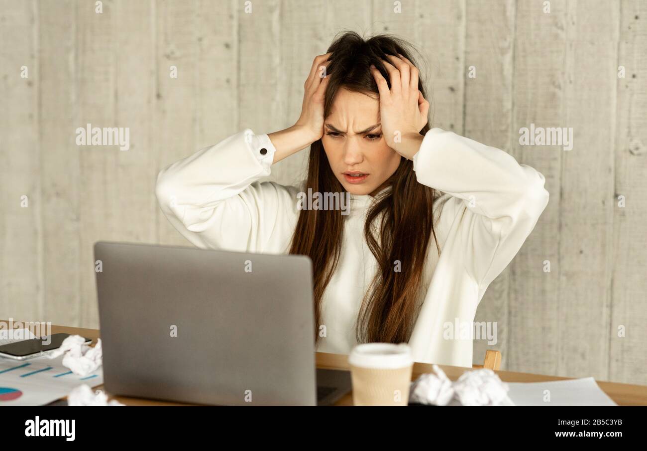 Freelance woman horrified by amount of work Stock Photo