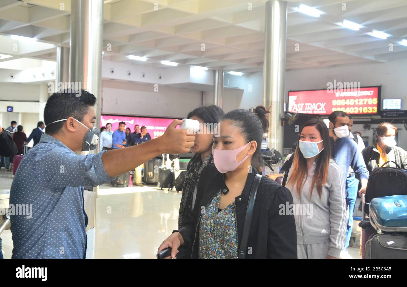 Dimapur, India. 08th Mar, 2020. Dimapur, India March 08, 2020: A Medical official use a thermal screening device on a passenger wearing protective mask on the wake of Corona Virus at Dimapur Airport, India north eastern state of Nagaland. Credit: Caisii Mao/Alamy Live News Stock Photo