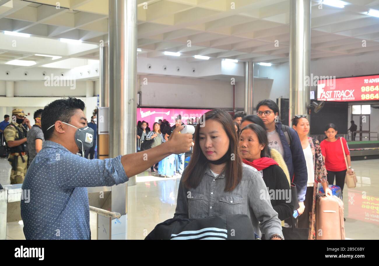 Dimapur, India March 08, 2020: A Medical official use a thermal screening device on a passenger on the wake of Corona Virus at Dimapur Airport, India north eastern state of Nagaland. Credit: Caisii Mao/Alamy Live News Stock Photo