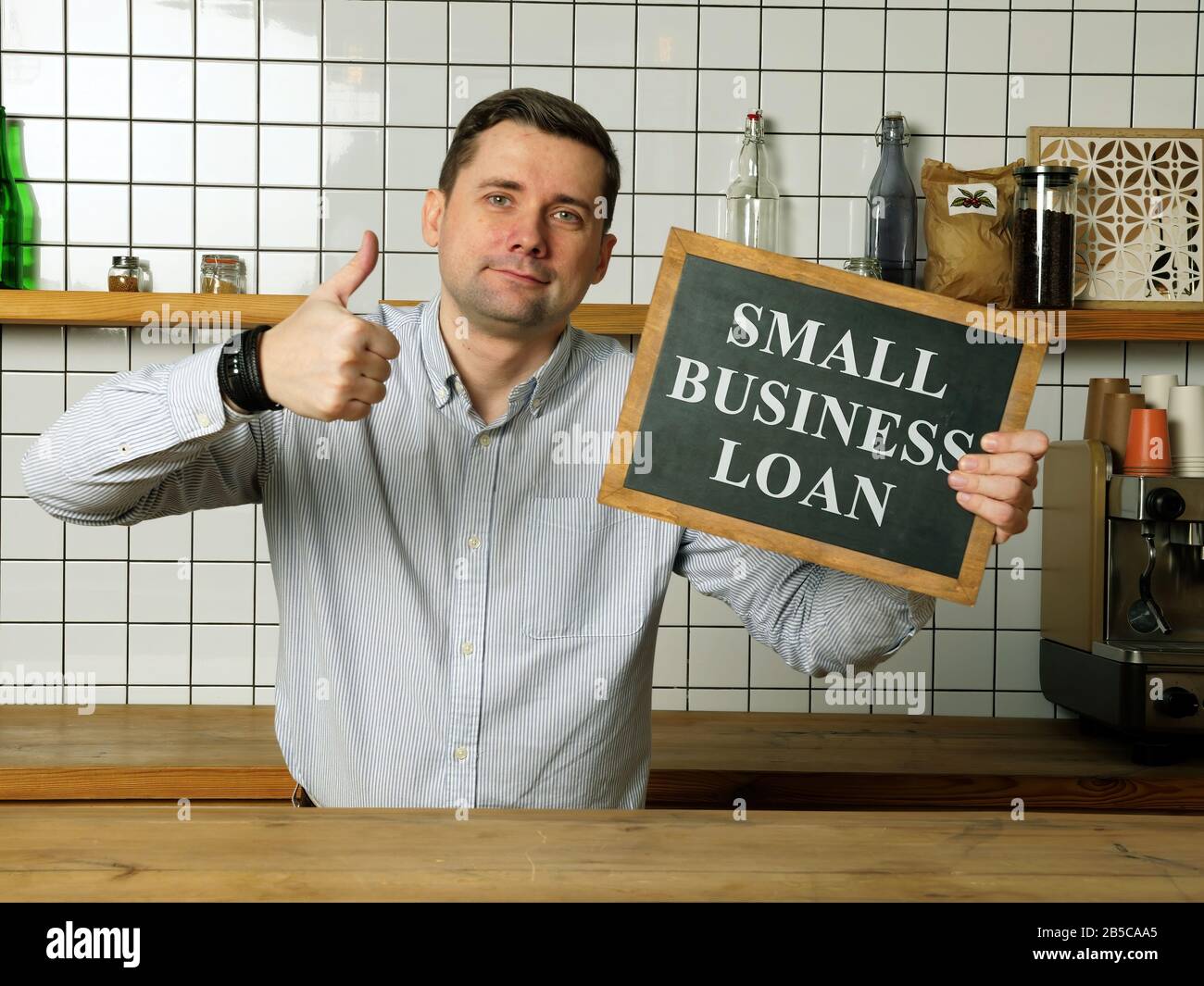Small business loan in the businessman hands. Stock Photo