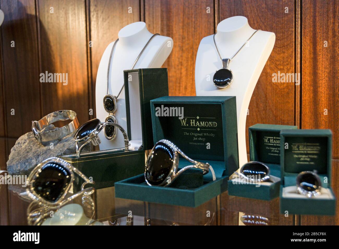 A large window display of Whitby Jet Black rings and necklaces at W.Hamond the famous original
