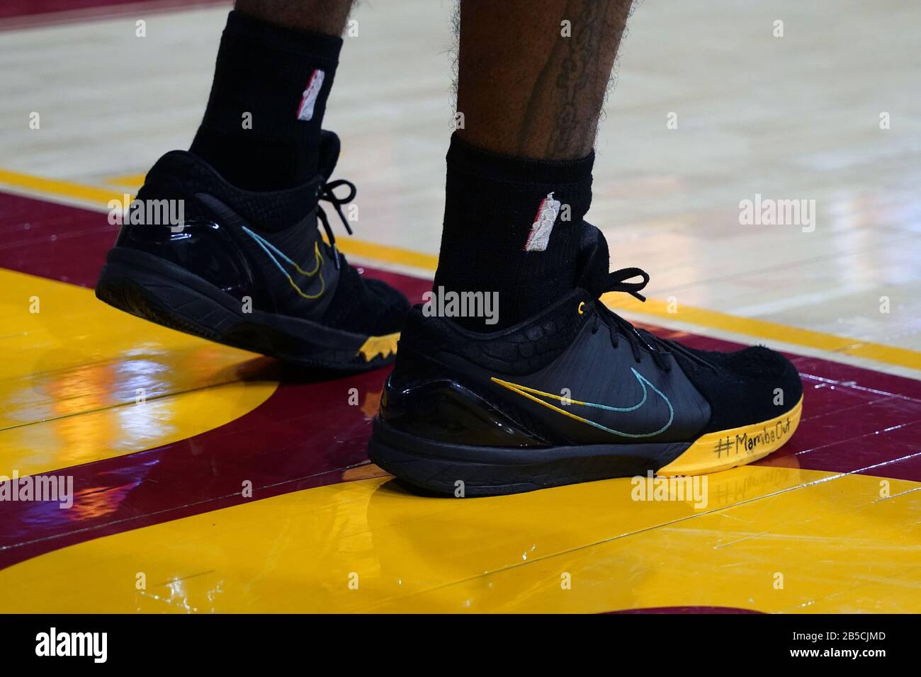 Detailed view of the black and yellow Nike shoes worn by Southern  California Trojans guard Daniel Utomi (4) with the hashtag #MambaOut  written on them in the memory of Kobe Bryant during